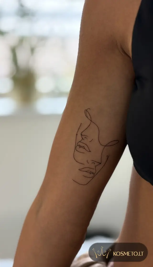 Linijinė dviejų veidų tatuiruotė ant rankos, Veta Pluščiauskytė